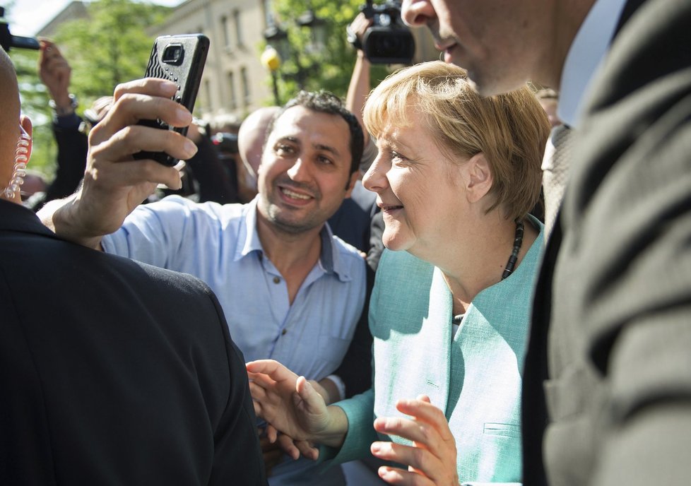 Angela Merkel a selfie s uprchlíky