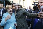 Německá kancléřka Angela Merkelová a selfie s uprchlíky