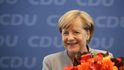 Merkelová den po volebním vítězství: V Berlíně na setkání lídrů dostala velkou kytici