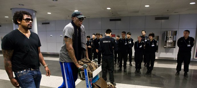 Rodman na letišti v Pekingu