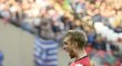 Obránce Arsenalu Per Mertesacker se raduje po vyrovnávacím gólu, který vynutil pro svůj tým v souboji s Wiganem prodloužení