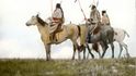 Riders with coup sticks. Blackfeet. Montana. Early 1900s. 