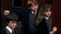 Daniel Radcliffe, Rupert Grint a Emma Watsonová ve filmu Harry Potter a Kámen mudrců