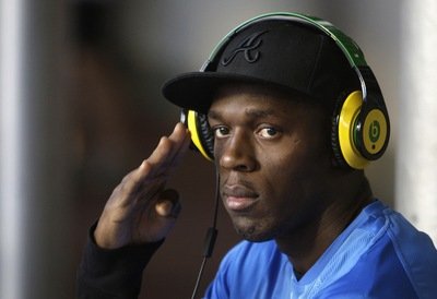 Usain Bolt je miláčkem celé Zlaté tretry, vděčné fotoreportéry nevyjímaje. Má pro ně vždy nějakou »švejkovinu«.