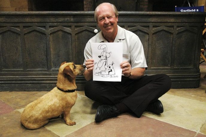 Jim Davis s nakreslenou postavičkou psa Odieho