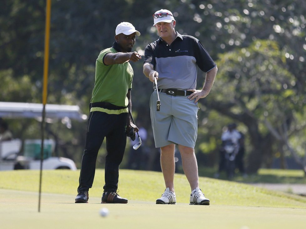 Novozélandský ministerský předseda John Key na golfu