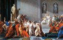Ubodání Julia Caesara v římském senátu. Caesar sám ještě nenosil titul císař, jeho prvním držitelem byl jeho adoptivní syn Augustus. Stejně jako mnozí císaři však zahynul násilnou smrtí v důsledku spiknutí