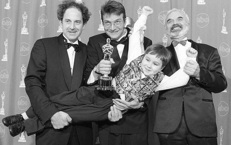Zdenek Sverak(R), Jan Sverak(C) and Eric Abraham(L) hold Andrei Chalimon after they won the Oscar for best foreign film for "Kolya" during the 69th Annual Academy Awards 24 March 1997 in Los Angeles. It was the first Academy Award won for a film from the Czech Republic. AFP PHOTO Kim Kulish