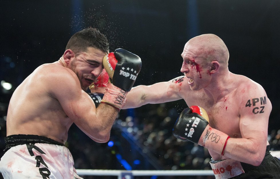 Karim Achour of France, left, and Lukas Konecny of Czech Republic fight for the WBO Europe middleweight title in Magdeburg, Germany, Saturday, March 23, 2013. Konecny won by unanimous decision. (AP Photo/Gero Breloer)