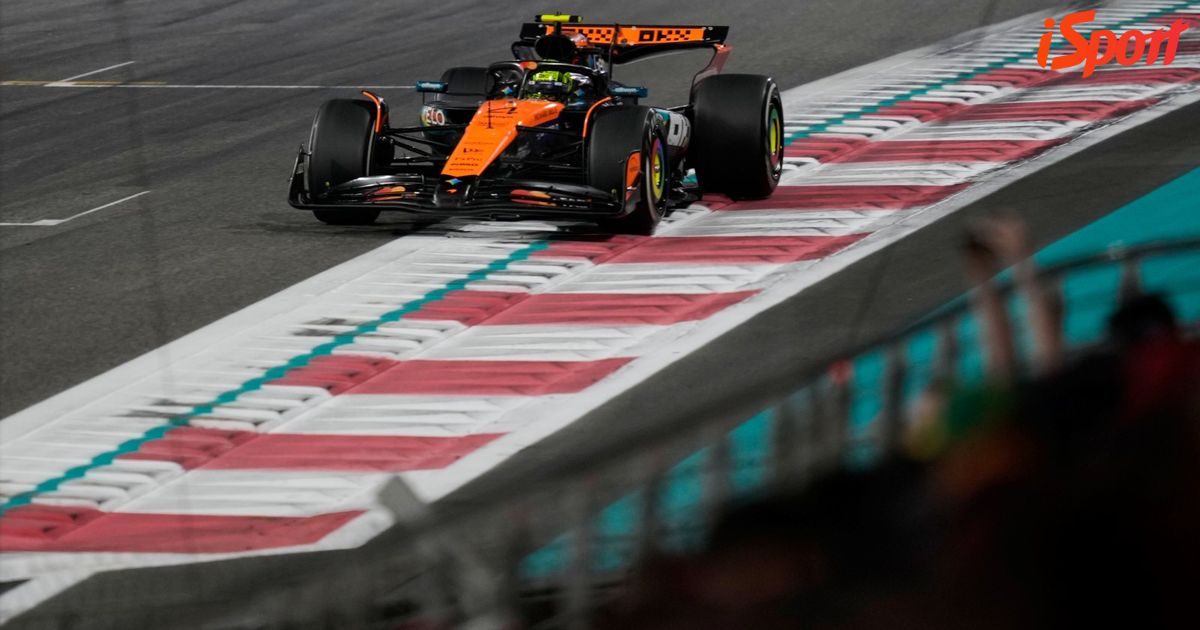 Lando Norris in his McLaren racing gear during a Formula 1 event.