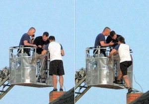 Záchrana muže, který několik hodin odmítal slézt ze střechy domu v Malešicích.