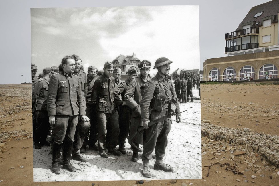 Britští vojáci střeží německé zajatce na pláži Juno.