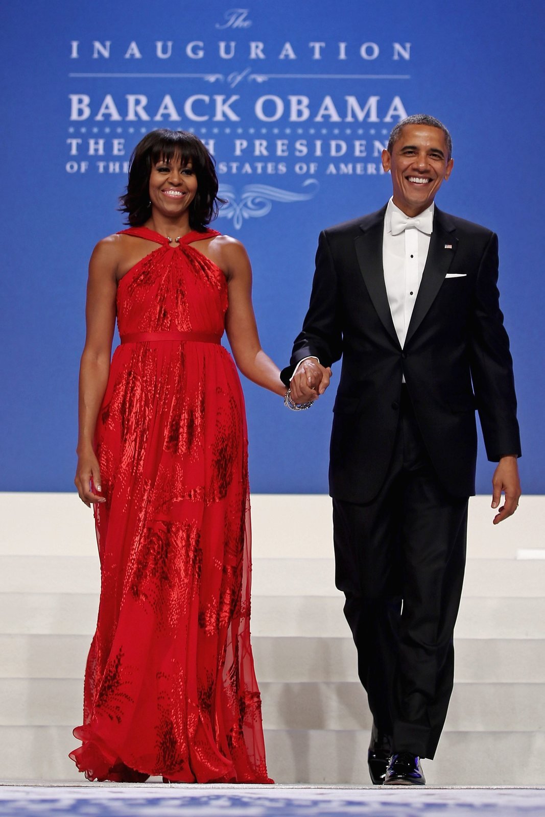 epa03549187 US President Barack Obama and first lady Michelle Obama arrive for the Inaugural Bal at the Walter E. Washington Convention Center, in Washington, DC, USA, 21 January 2013. Earlier in the day, Obama was ceremonially sworn in for a second term as the 44th President of the United States.  EPA/Chip Somodevilla / POOL -