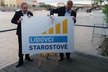 Pavel Bělobrádek (KDU-ČSL) a Petr Gazdík (Starostové) představují logo nové koalice.