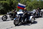 Putin na tříkolce Harley Davidson.