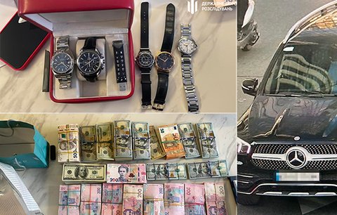 Luxusní hodinky, šperky, haldy peněz i mercedes psaný na šoféra: Co odhalila razie u šéfky berňáku Kyjeva