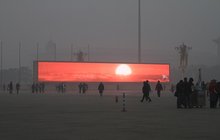 Číňané vyzráli nad smogem: Promítají východ slunce! 