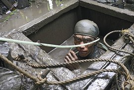 Illegal gold mining in the Philippines or diving in deadly mud for a shiny piece of metal