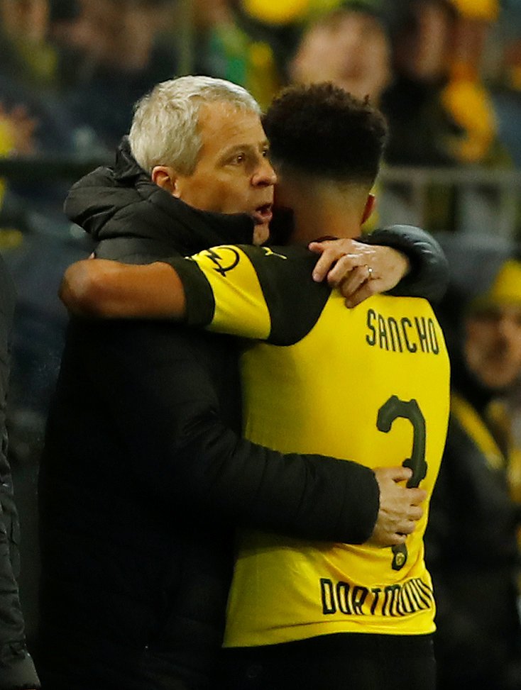 Jadon Sancho s trenérem Dortmundu Lucienem Favrem