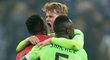 Andre Onana, Matthijs de Ligt a Davinson Sanchez slaví výhru Ajaxu na půdě Schalke v Evropské lize