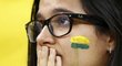 Výstižný obrázek: brazilská fanynka s vlajkou na tváři rozpuštěnou v slzách
