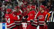 Carolina Hurricanes se radují z gólu útočníka Martina Nečase (uprostřed)