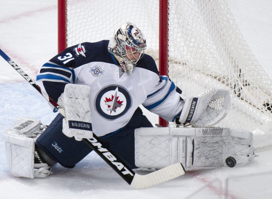 Ondřej Pavelec, brankář Winnipegu, mistr světa.