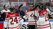 Hokejisté Kanady oslavují gól do sítě Slovenska
