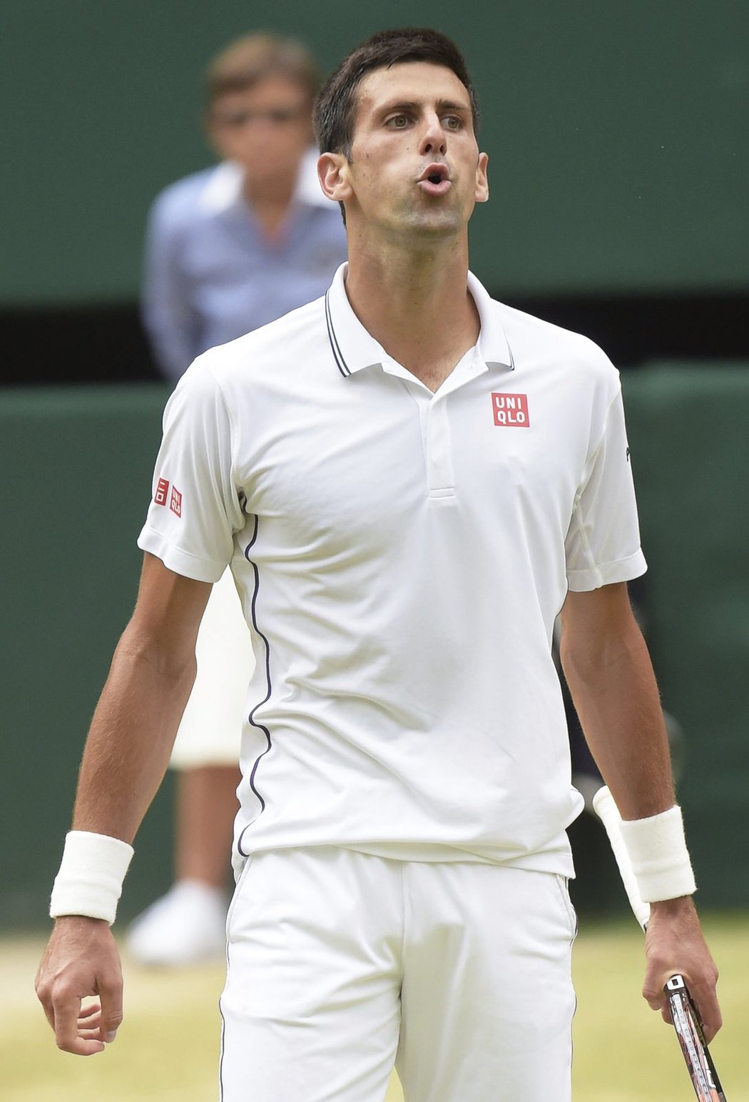 Novak Djokovič a jeho grimasa ve finále Wimbledonu s Rogerem Federerem