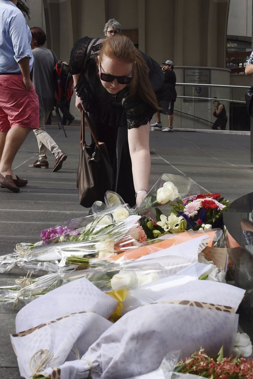 Smutek za oběti teroru v kavárně v Sydney