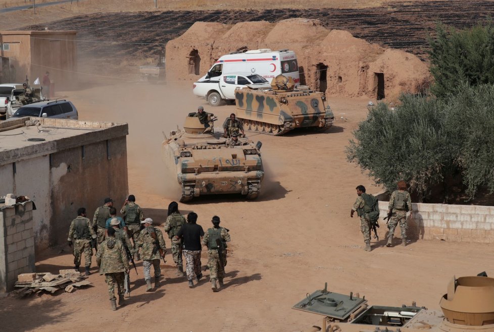 A Turkey, backed Syrian rebel fighter takes a rest near the border town of Tal Abyad