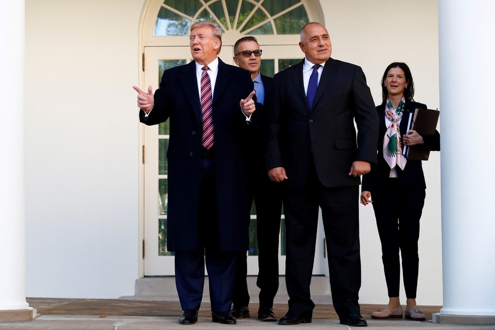 U.S. President Donald Trump speaks to the news media next to Vice President Mike Pence and Conan, the U.S. military dog that participated in and was injured in the U.S. raid in Syria that killed ISIS leader Abu Bakr al, Baghdadi