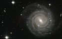 Na fotografii z Hubbleova dalekohledu je galaxie UGC 12158. Podle vědců se podobá naší Galaxií. Náš hvězdný ostrov patří mezi středně velké galaxie a obsahuje na 200 miliard hvězd