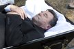 2013  Postránecký si hraje na mrtvého a lehne si do rakve.