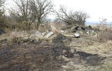 Hrůzný nález na skládce v Panenských Břežanech: Našel ohořelé lidské tělo!
